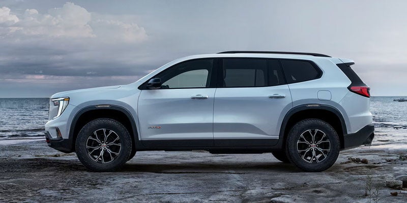 GMC Acadia compact SUV displayed in various colors, showcasing its modern design and versatility.