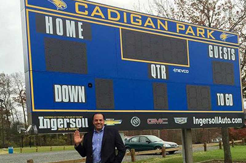 Ingersoll Auto of Danbury Buick GMC's name is on a local sports scoreboard for donating